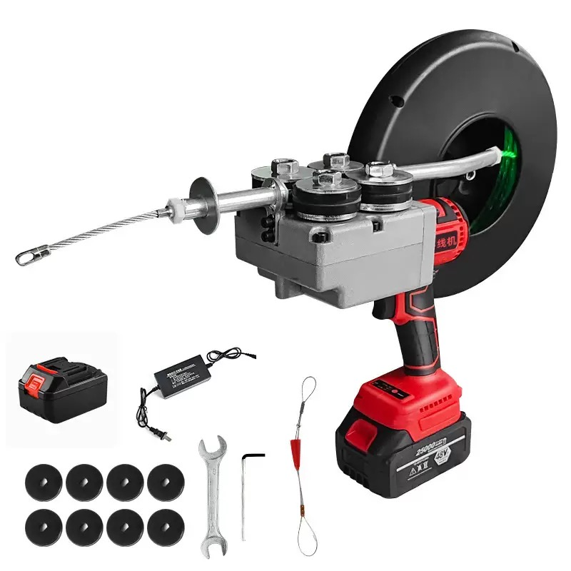 Electrician using wire puller on panel